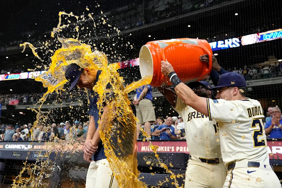 The Brewers' Jacob Misiorowski is doused with a sports drink by Caleb Durbin and Andruw Monasterio after a win.