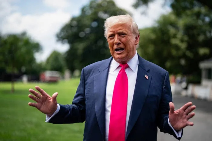 US President Donald Trump speaks to members of the media on the South Lawn of the White House before boarding Marine One