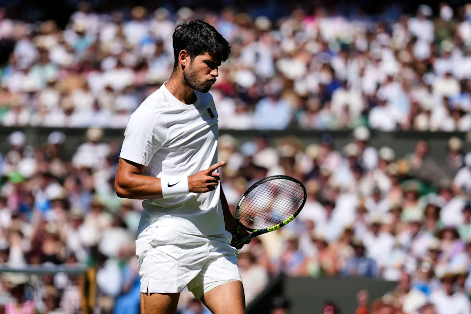 Carlos Alcaraz of Spain reacts in the Gentlemen's Singles Semi Finals match against Taylor Fritz of the United States on day twelve of The Championships Wimbledon 2025 at All England Lawn Tennis and Croquet Club on July 11, 2025 in London, England. (Photo by Shi Tang/Getty Images)