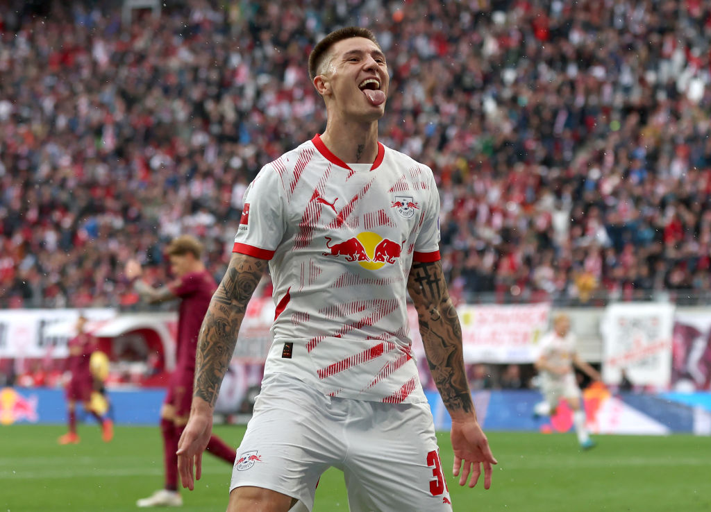 Arsenal target Benjamin Sesko of RB Leipzig celebrates scoring his team's second goal during the Bundesliga match between RB Leipzig and FC Augsburg at Red Bull Arena on September 28, 2024 in Leipzig, Germany.