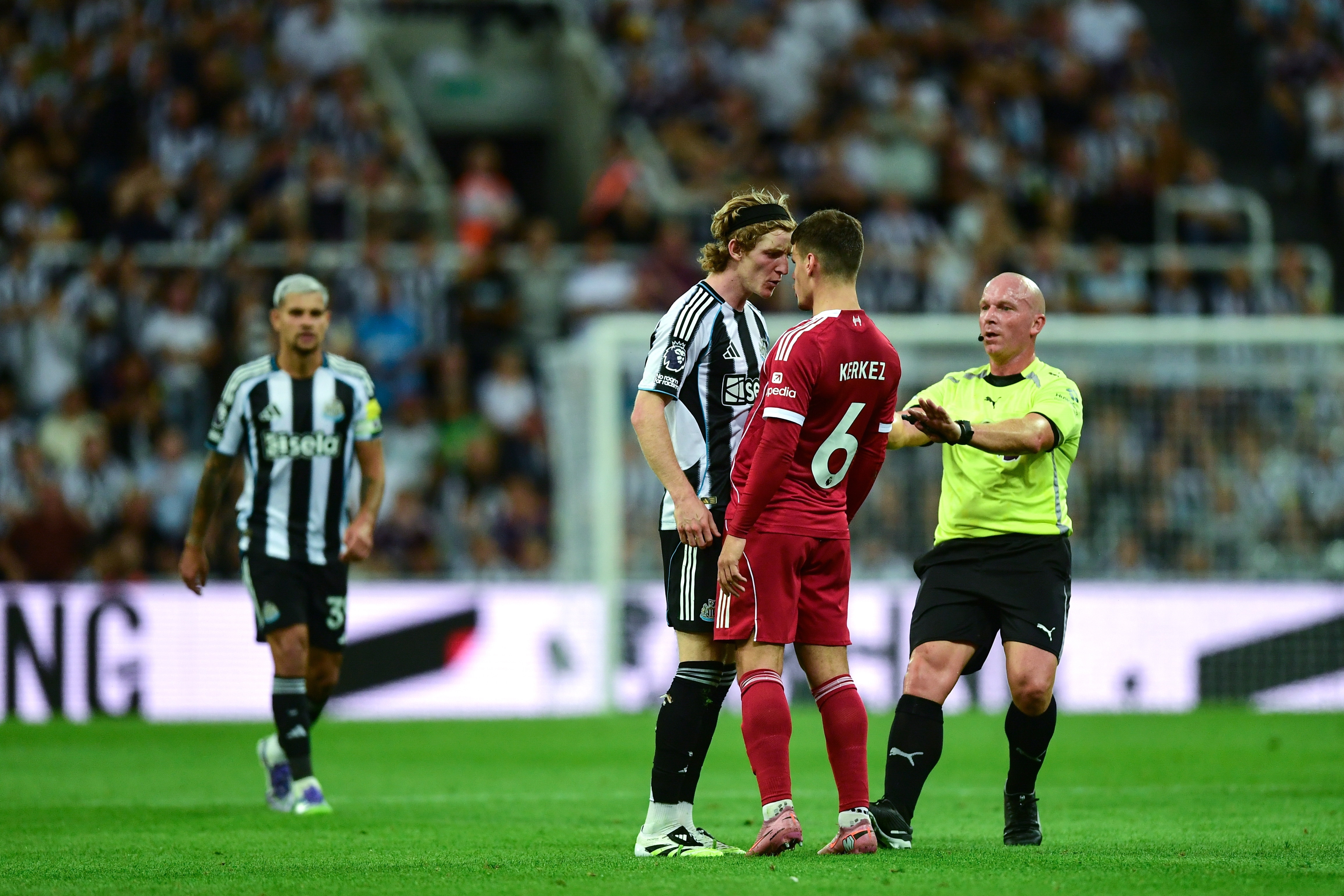 Anthony Gordon is sent off for a challenge on Virgil van Dijk