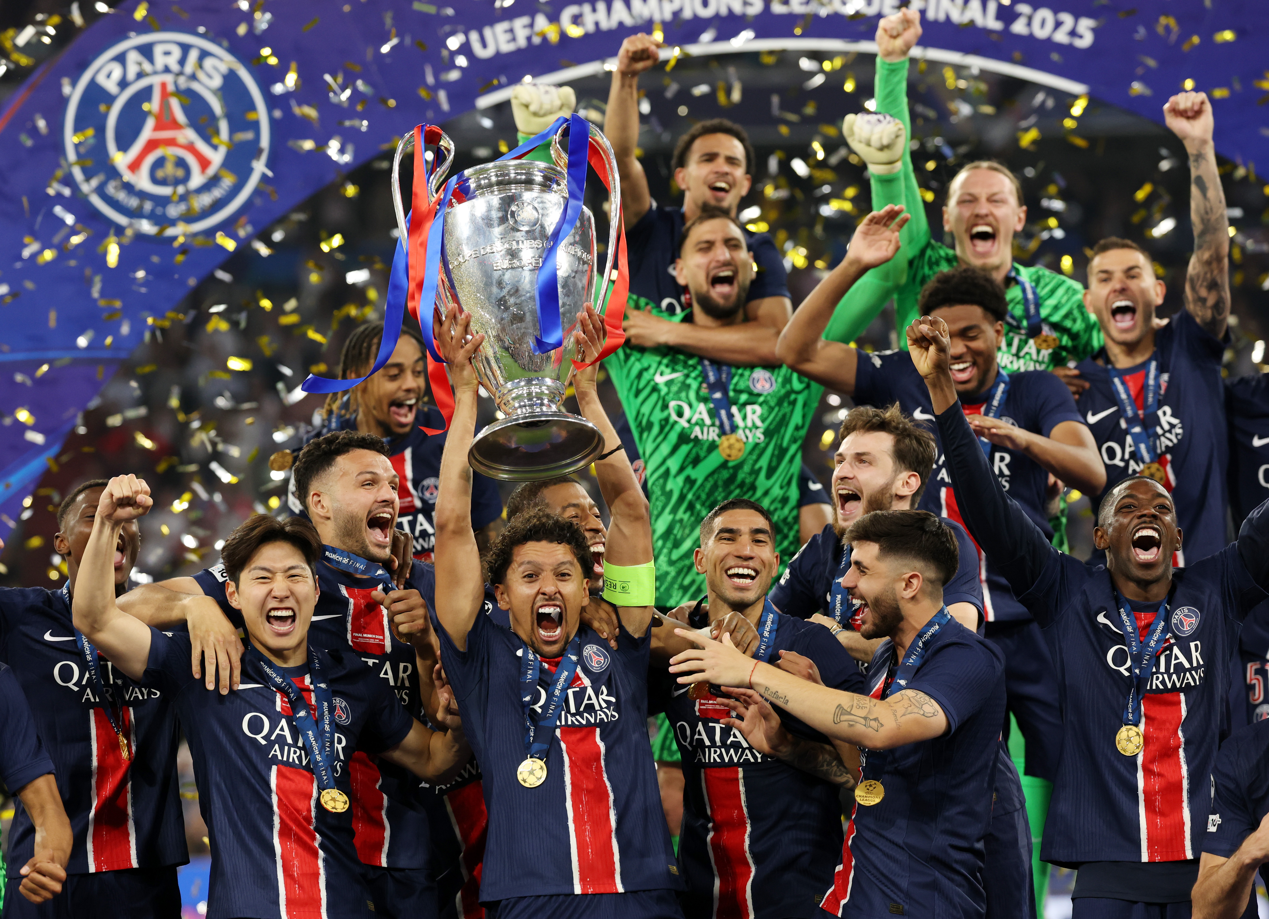 PSG captain Marquinhos lifts the Champions League trophy aloft