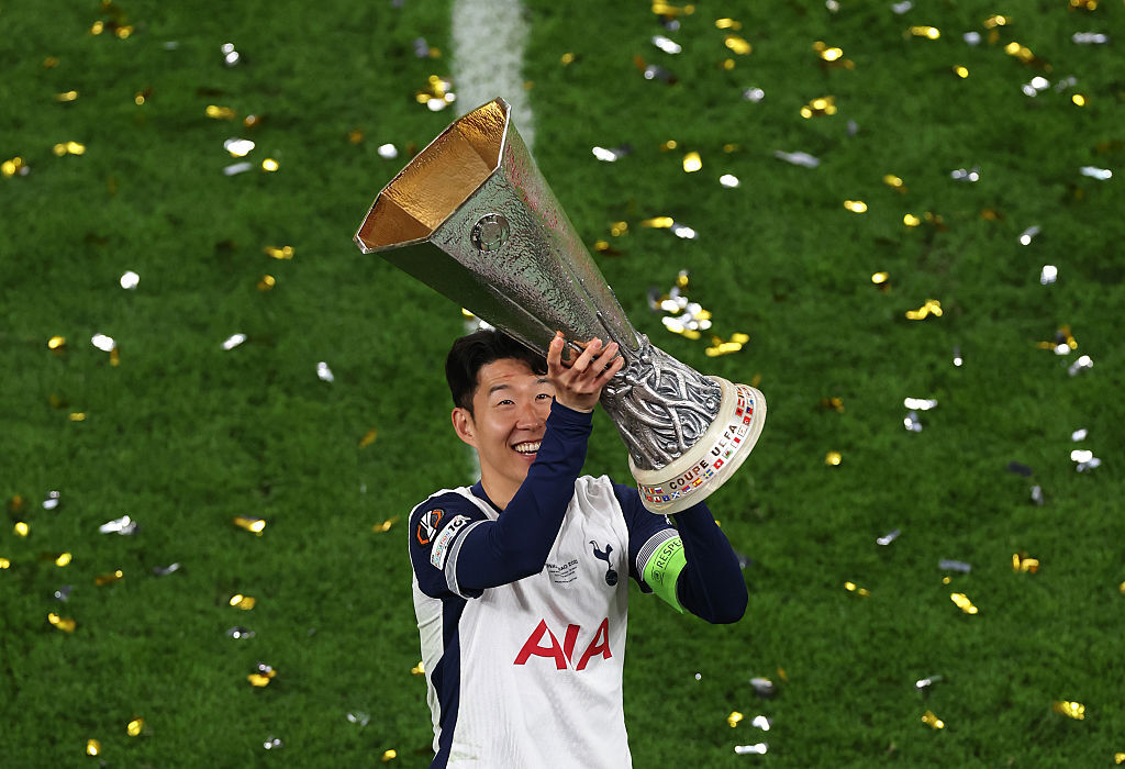 Son Heung-min holding the Europa League trophy