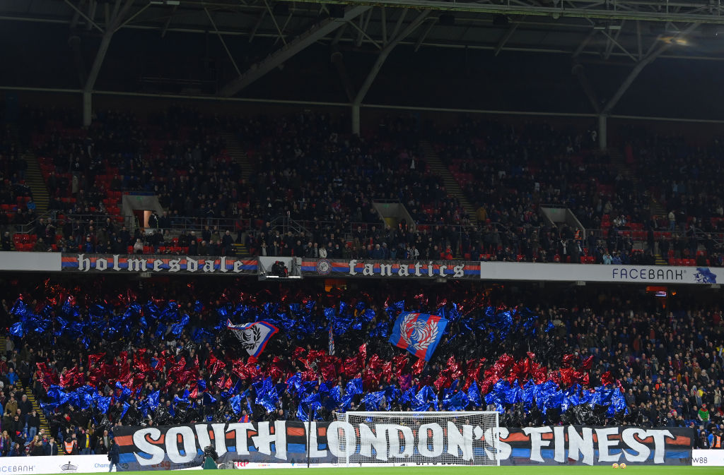 A general view inside the stadium as fans of Crystal Palace displays banners in support of their side prior to the Premier League match between Crystal Palace and Everton at Selhurst Park on December 12, 2021 in London, England.