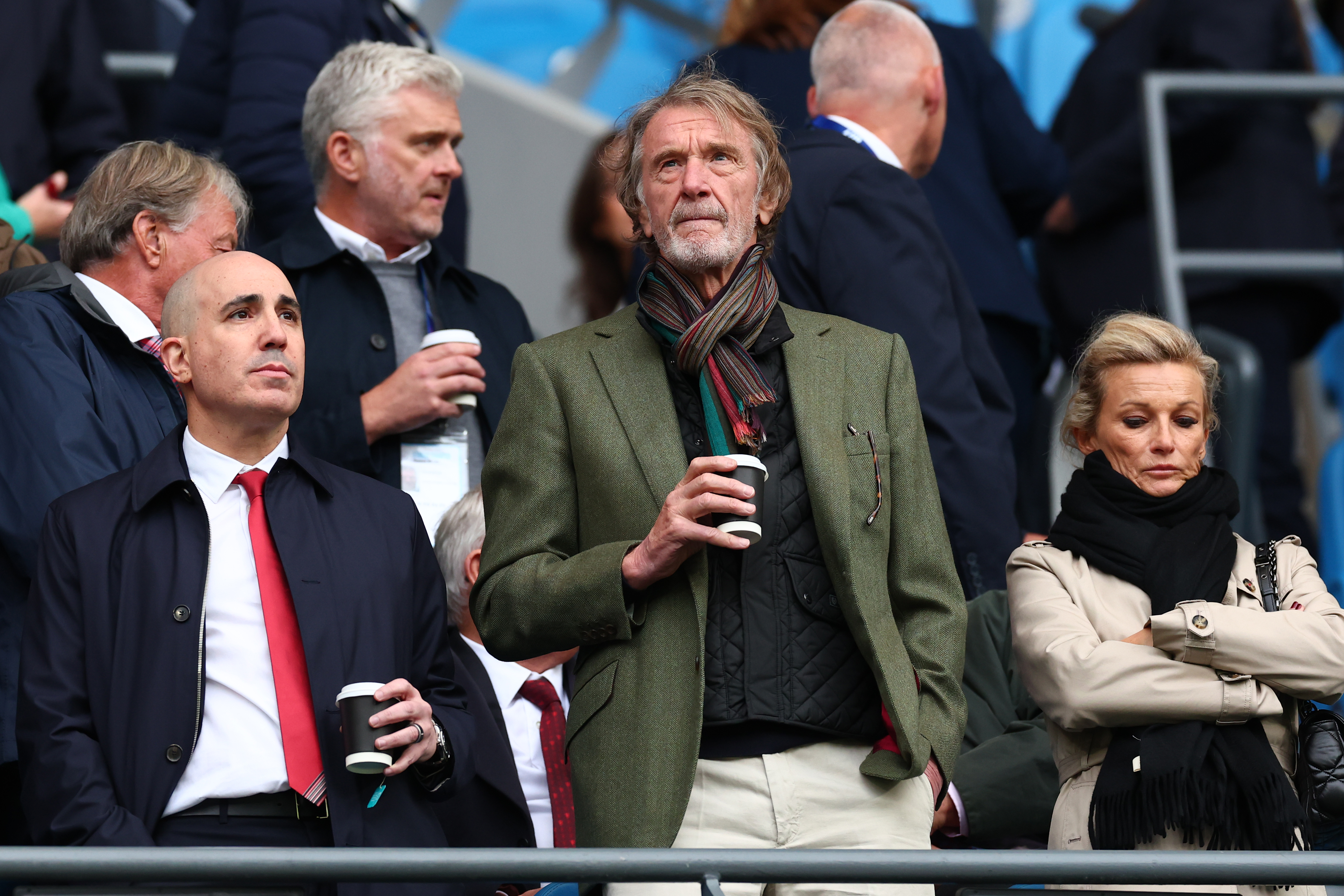 Omar Berrada (L) and Jim Ratcliffe (C) watch the Manchester derby