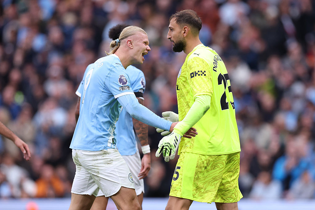 Gianluigi Donnarumma of Manchester City is congratulated by Erling Haaland after making a save during the Premier League match between Manchester City and Manchester United at Etihad Stadium on September 14, 2025 in Manchester, England.