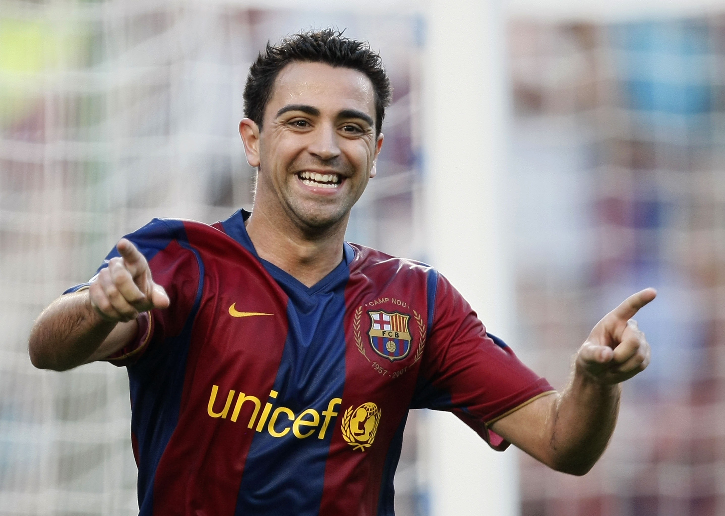 Xavi celebrates a goal for Barcelona against Atletico Madrid in October 2007.
