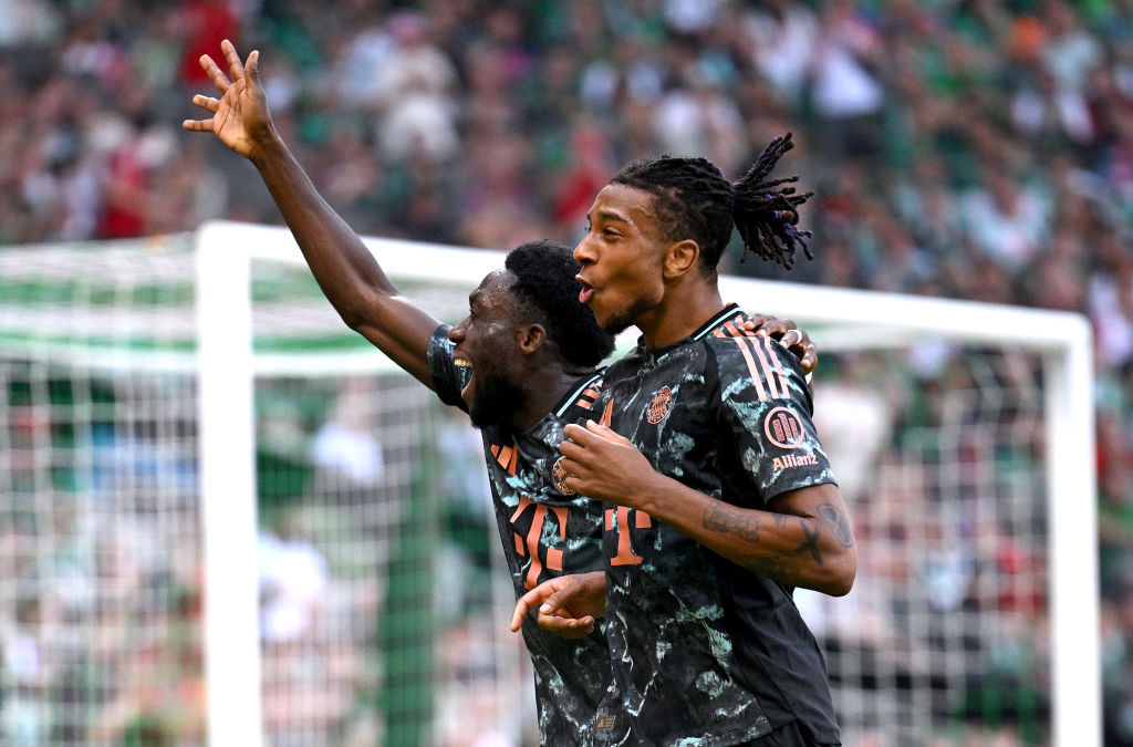 Michael Olise of Bayern Munich celebrates with Alphonso Davies after scoring his team's fourth goal during the Bundesliga match between SV Werder Bremen and FC Bayern M&uuml;nchen at Weserstadion on September 21, 2024 in Bremen, Germany.