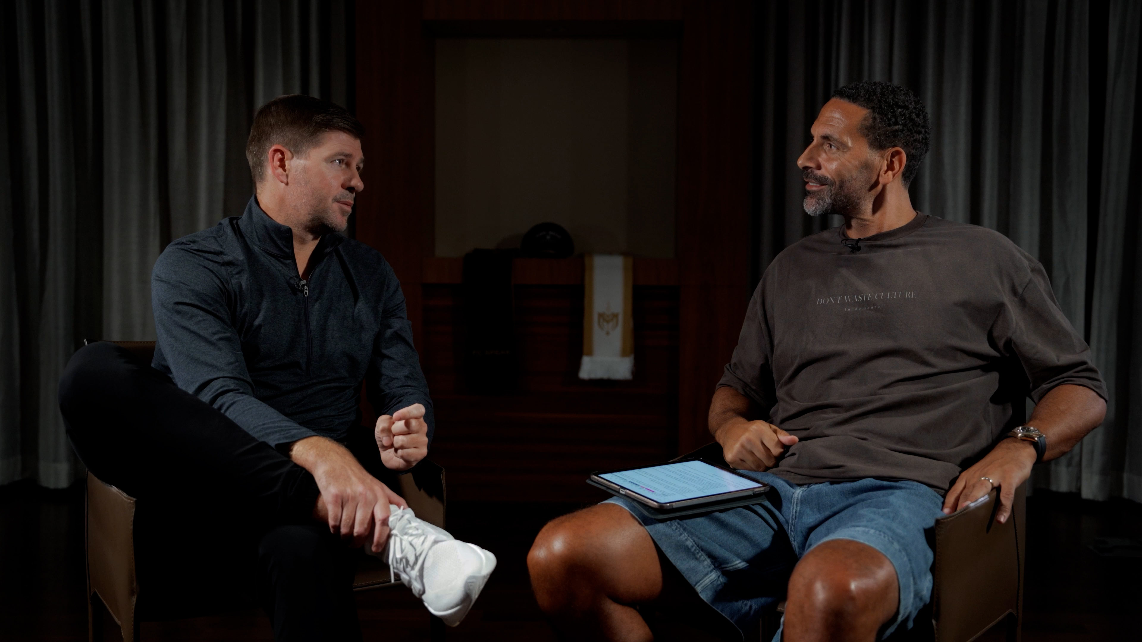 Steven Gerrard (L) sits alongside Rio Ferdinand (R)
