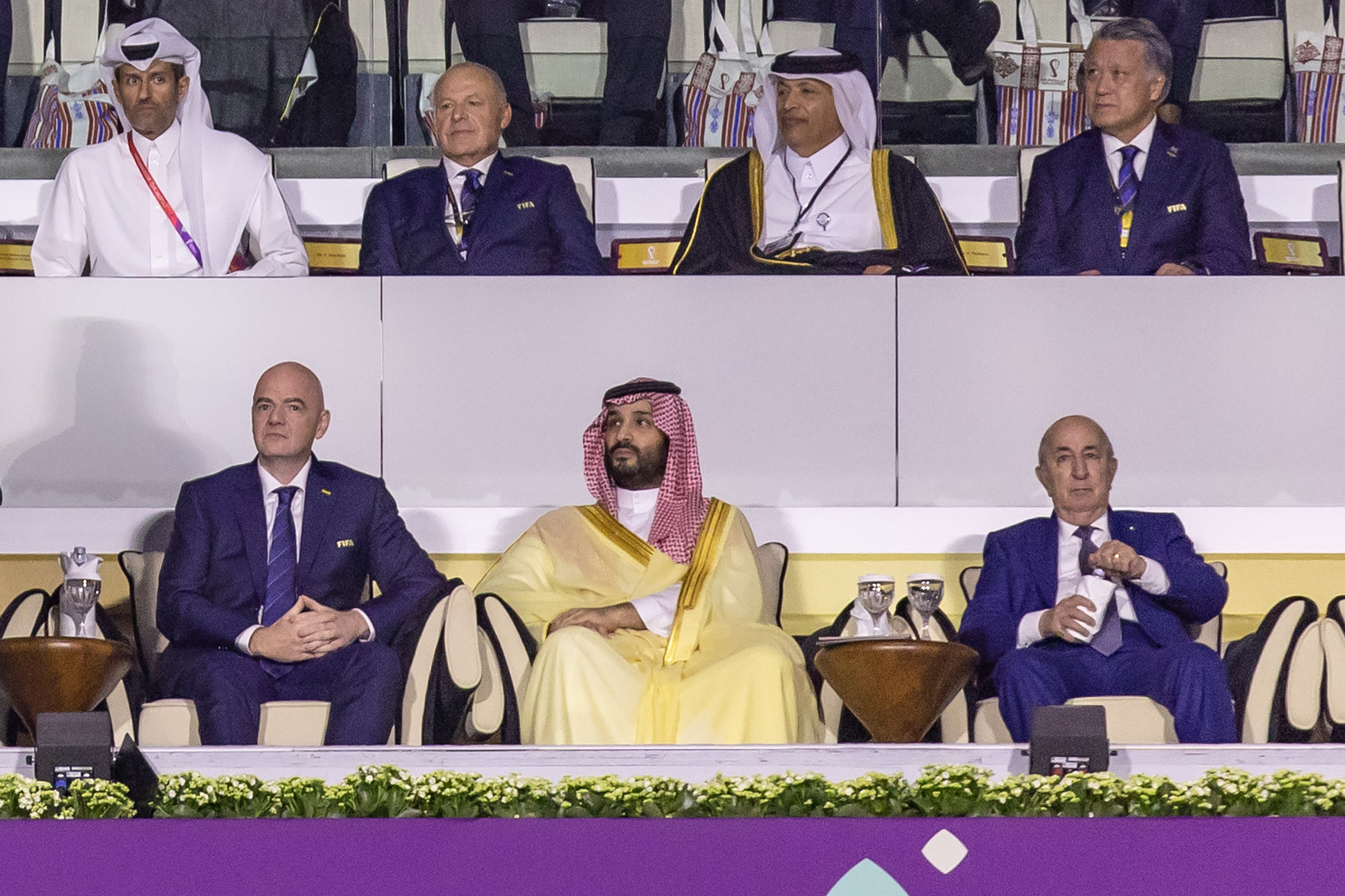 FIFA President Gianni Infantino (L) sat alongside Saudi Arabian Crown Prince Mohammed bin Salman (C) at the 2022 FIFA World Cup.