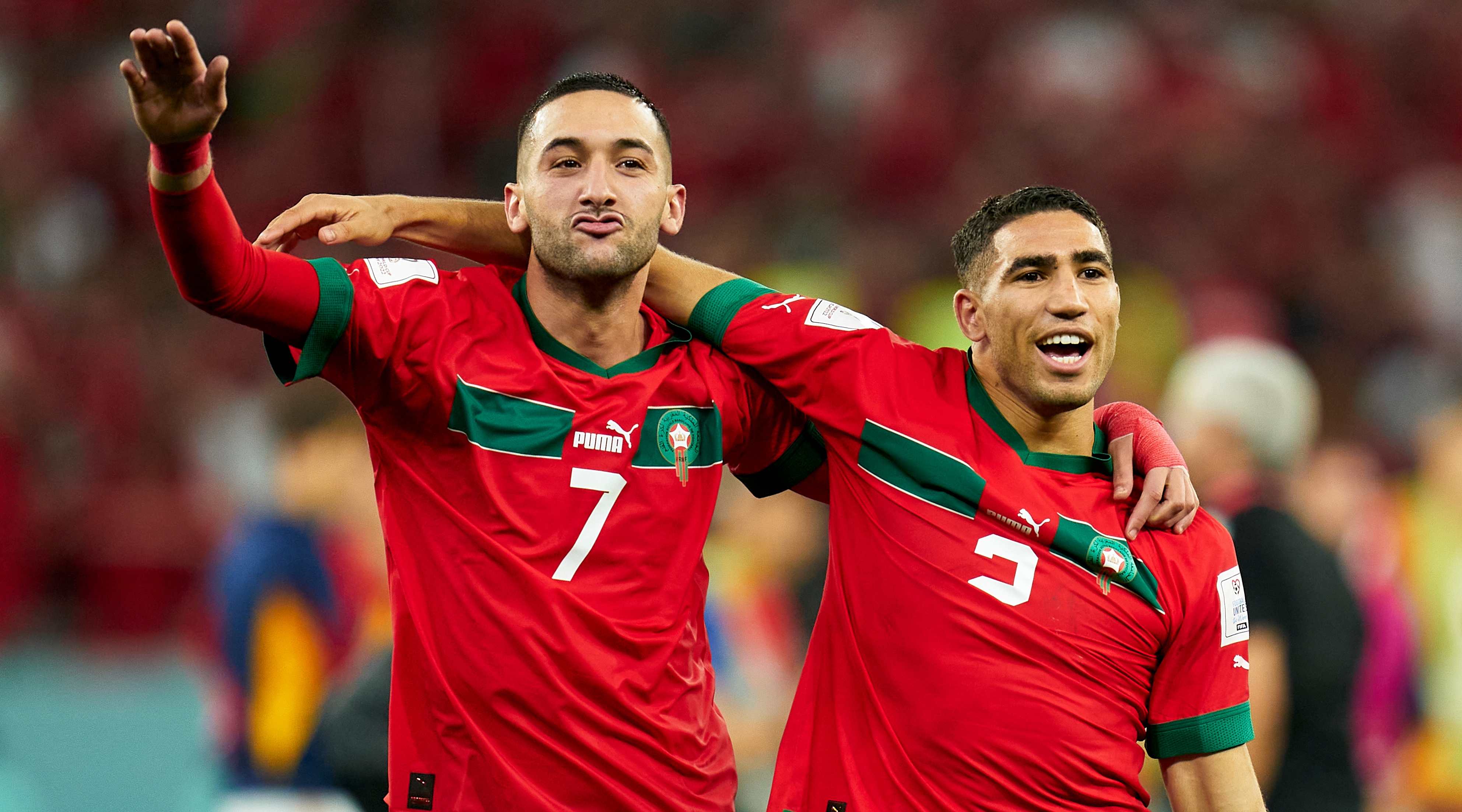 Hakim Ziyech and Achraf Hakimi of Morocco celebrate after the team's victory during the FIFA World Cup Qatar 2022 Round of 16 match between Morocco and Spain at Education City Stadium on December 06, 2022 in Al Rayyan, Qatar.