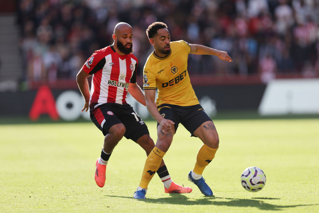 Matheus Cunha of Wolverhampton Wanderers and Bryan Mbeumo of Brentford during the Premier League match between Brentford FC and Wolverhampton Wanderers FC at Gtech Community Stadium on October 05, 2024 in Brentford, England.