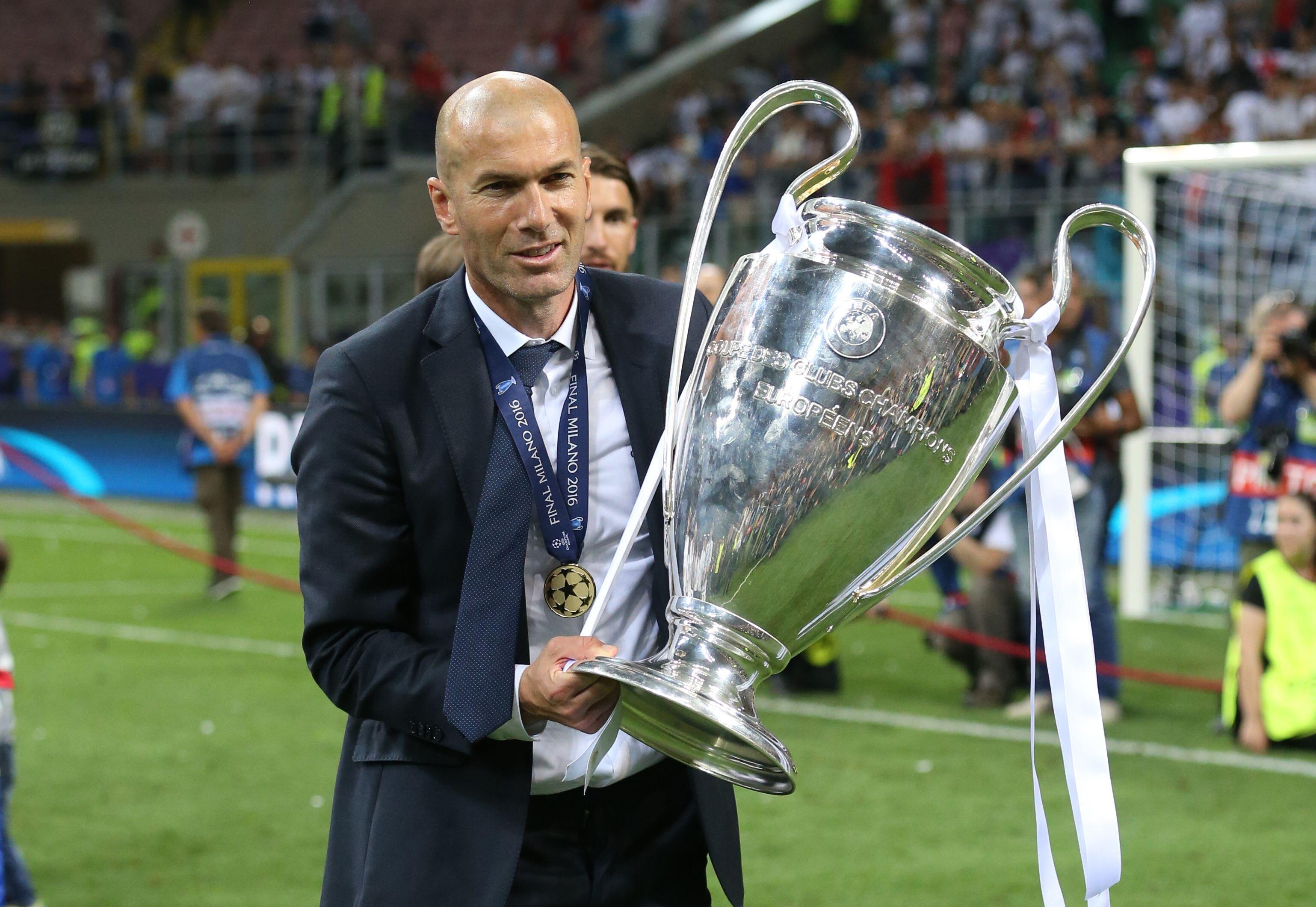 Real Madrid manager Zinedine Zidane holds the Champions League trophy, 2016