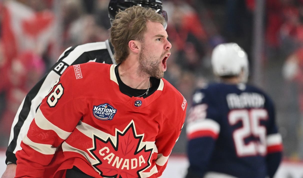 A men's hockey player reacts.