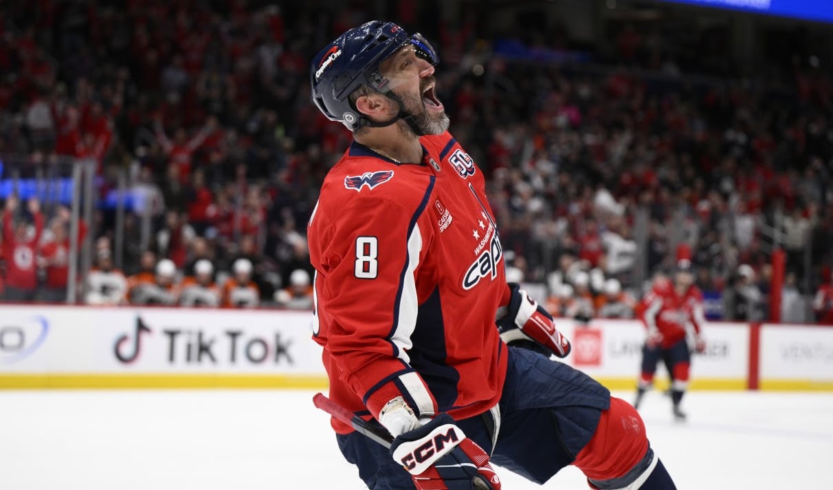 A men's hockey player celebrates.