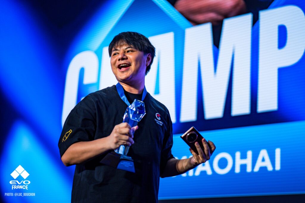 EVO France 2025 FATAL FURY Grand Finals champion XIaohai celebrating on stage following Grand Finals