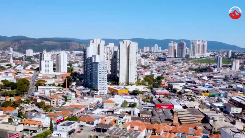 Image of Sao Paulo skyline with a Team Elevate logo in the top right corner
