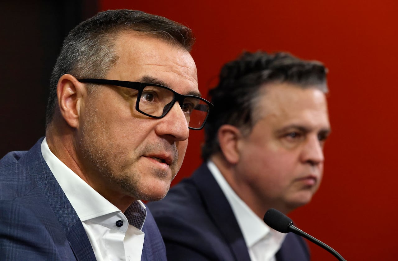 Two men at a press conference