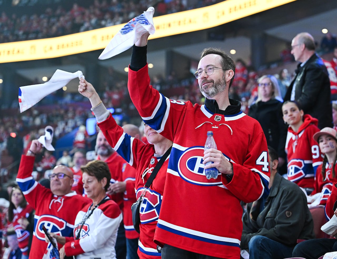 People in the stands cheering.