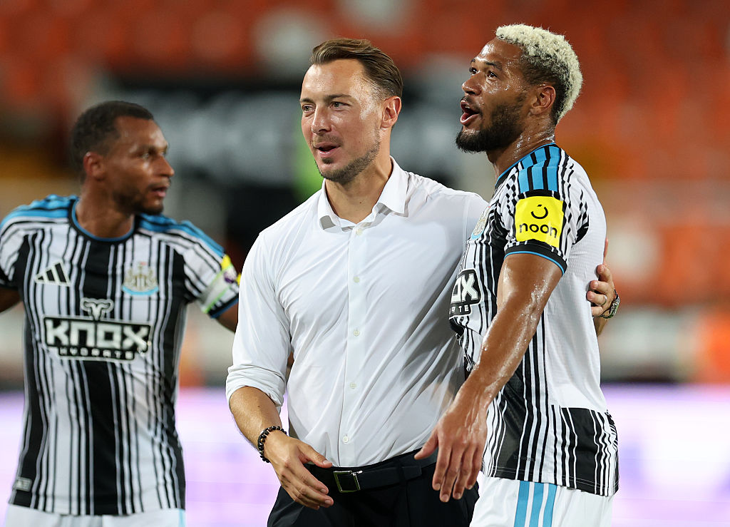 VALENCIA, SPAIN - AUGUST 08: Matthias Jaissle, Head Coach of Newcastle United, laughs with Joelinton of Newcastle United following the pre-season friendly match between Valencia CF and Newcastle United at Estadio Mestalla on August 08, 2026 in Valencia, Spain. (Photo by Clive Brunskill/Getty Images)
