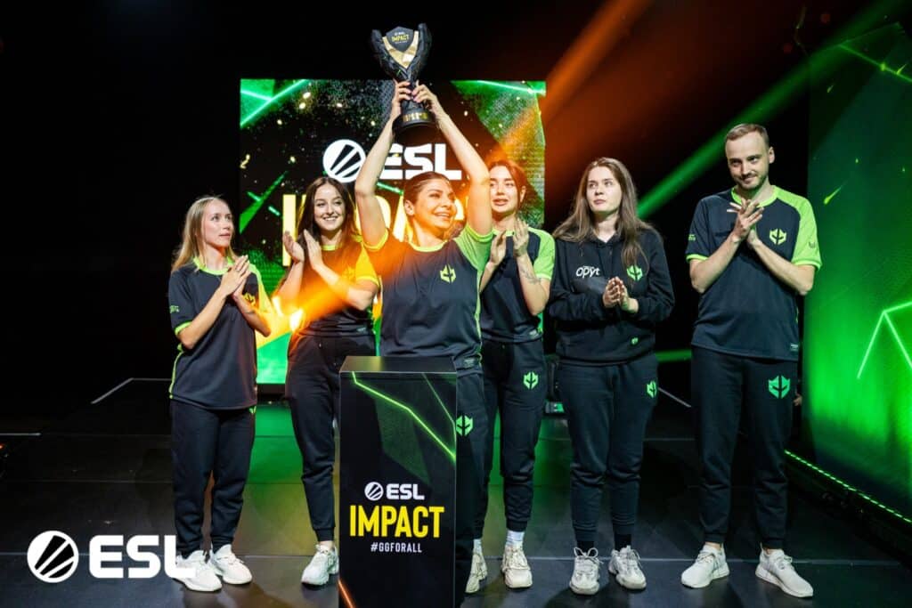 Imperial fe's female Counter-Strike team celebrating an ESL Impact tournament victory on stage
