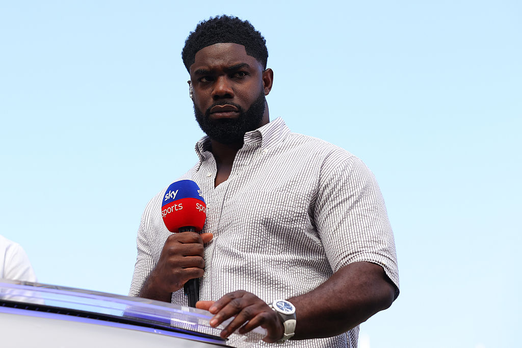 Pundit Micah Richards on duty for Sky Sports at Old Trafford during the Manchester United vs Arsenal match on August 17, 2025.