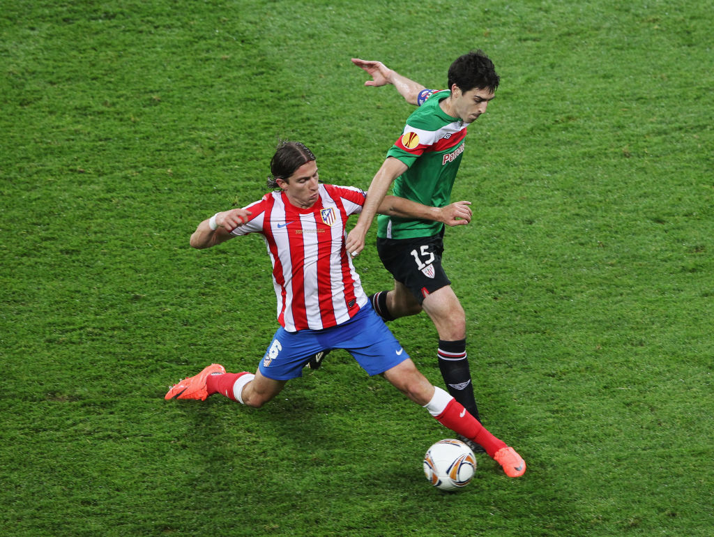 Atletico Madrid's Filipe Luis in a duel with Andoni Iraola