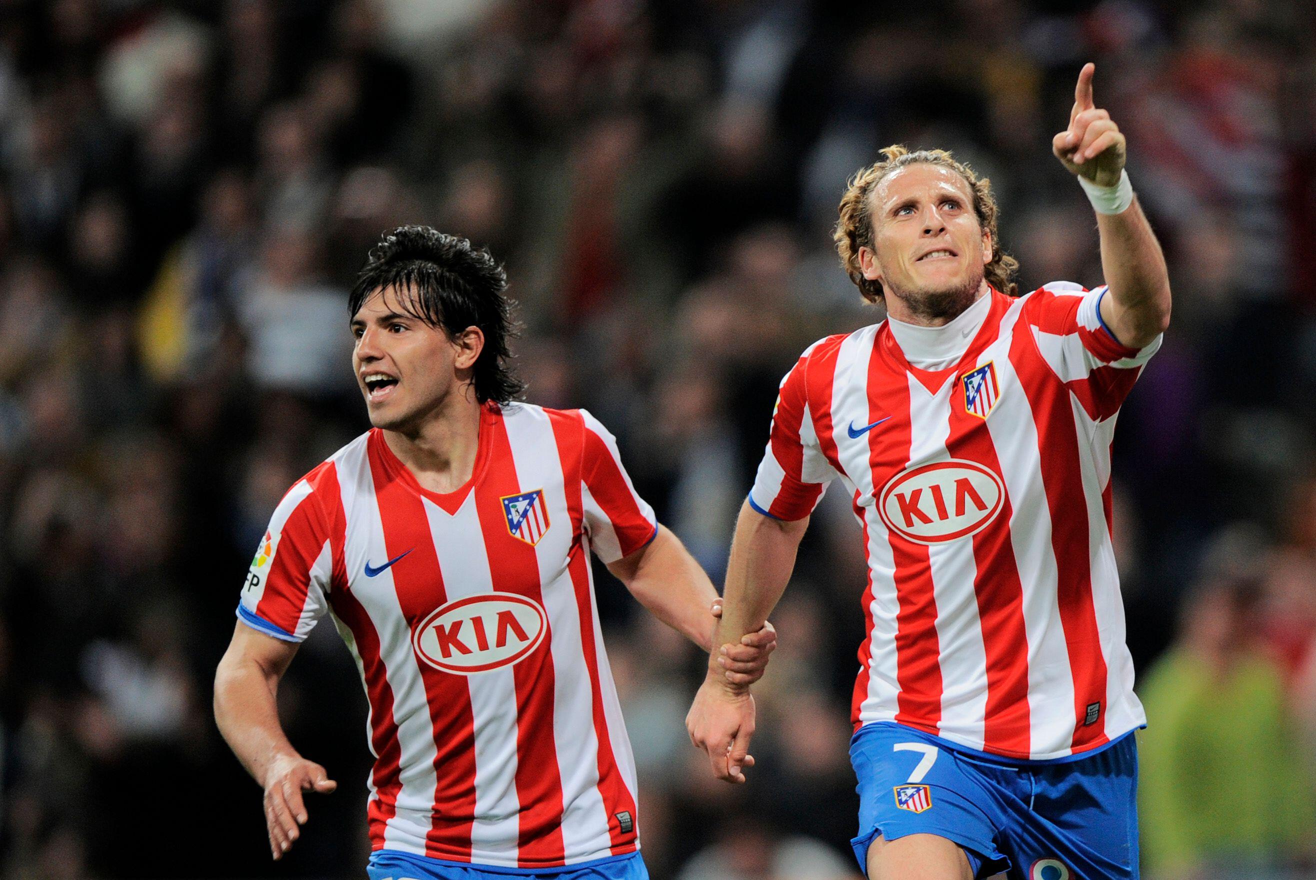 Sergio Aguero and Diego Forlan celebrate a goal for Atletico Madrid