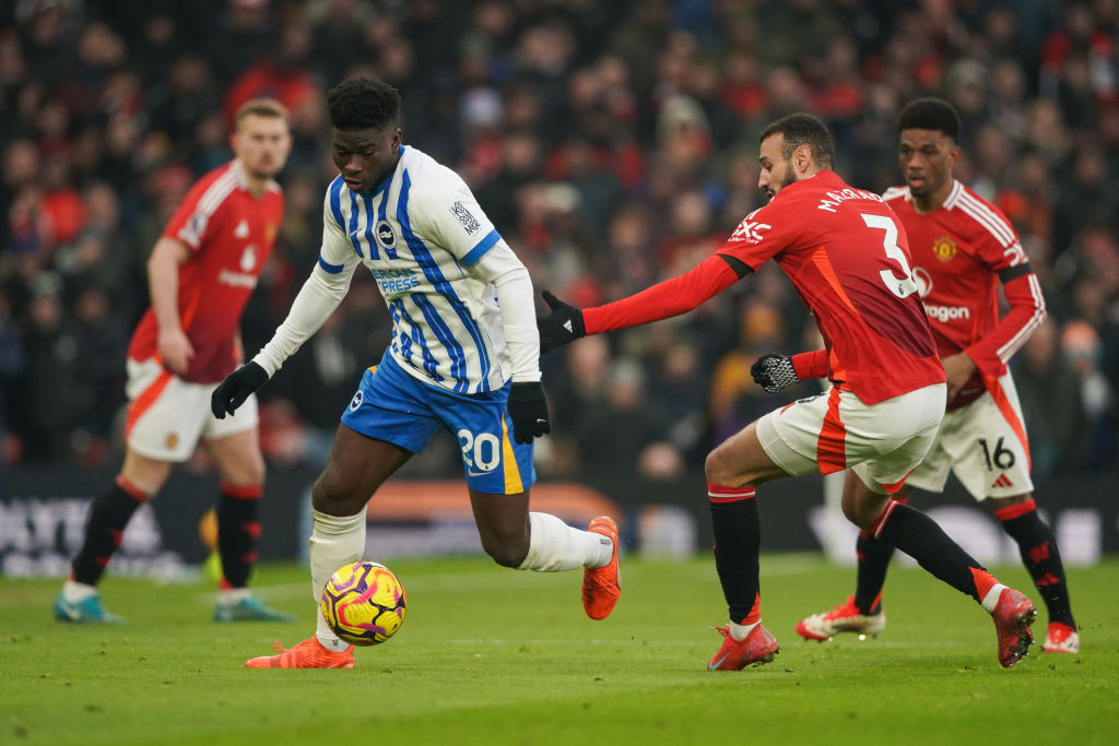 Carlos Baleba playing for Brighton during a fixture against Manchester United