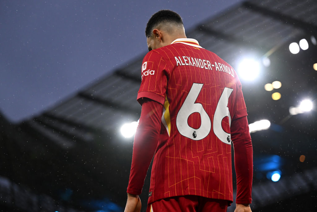 Trent Alexander-Arnold, back view, wearing a Liverpool shirt.