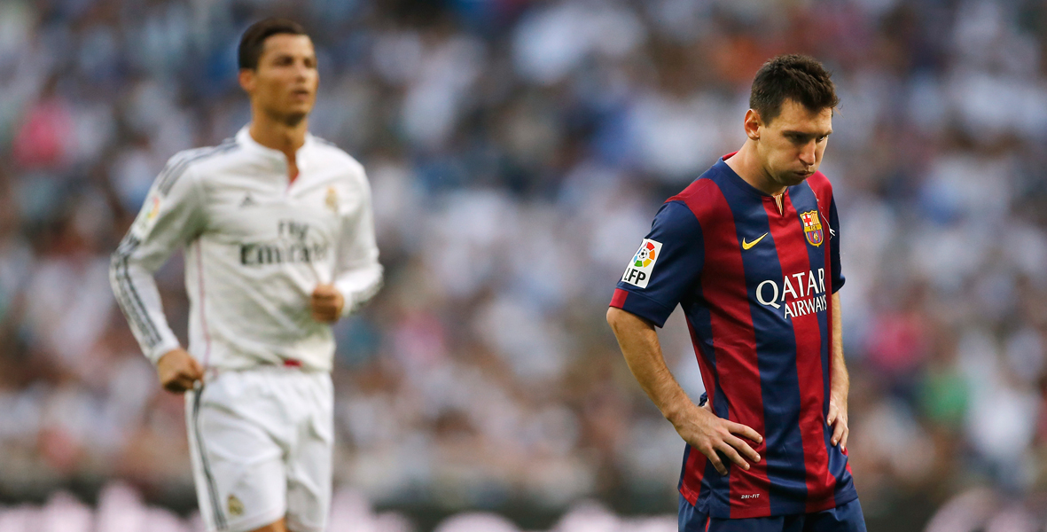 Messi and Ronaldo stood next to each other on the pitch, for Barcelona and Real Madrid respectively.