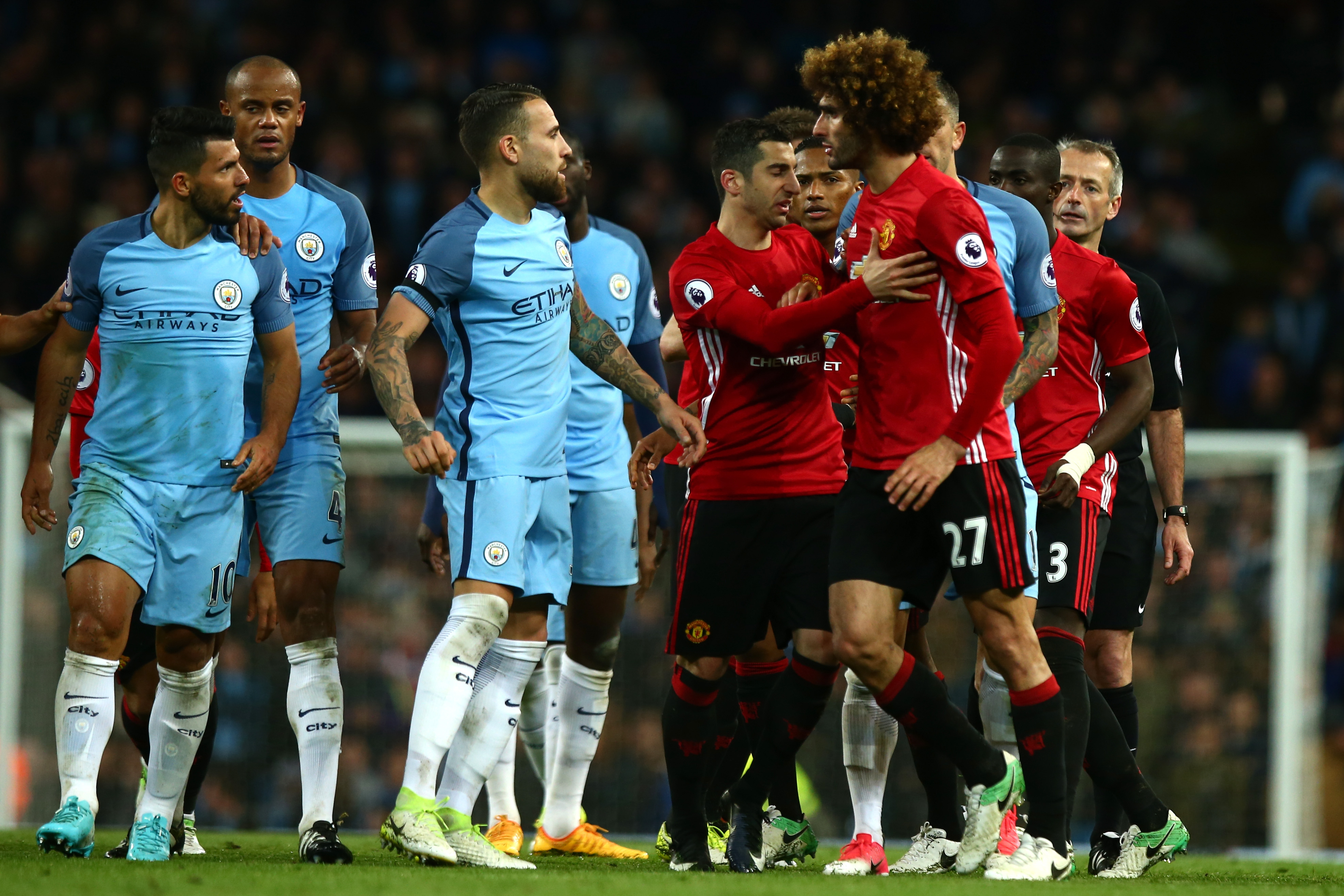 Manchester United's Marouane Fellaini reacts to Manchester City's Sergio Ag&uuml;ero after being sent off in the derby at the Etihad in April 2017.