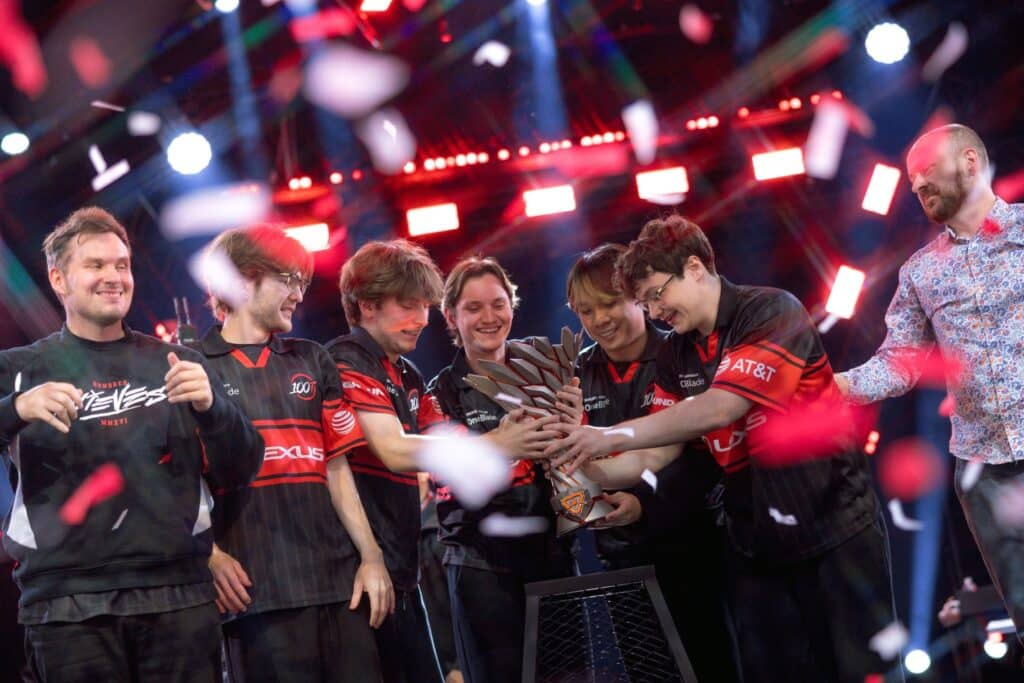 Photo of 100 Thieves celebrating on stage after winning the VCT Americas Stage 2 Grand Final.