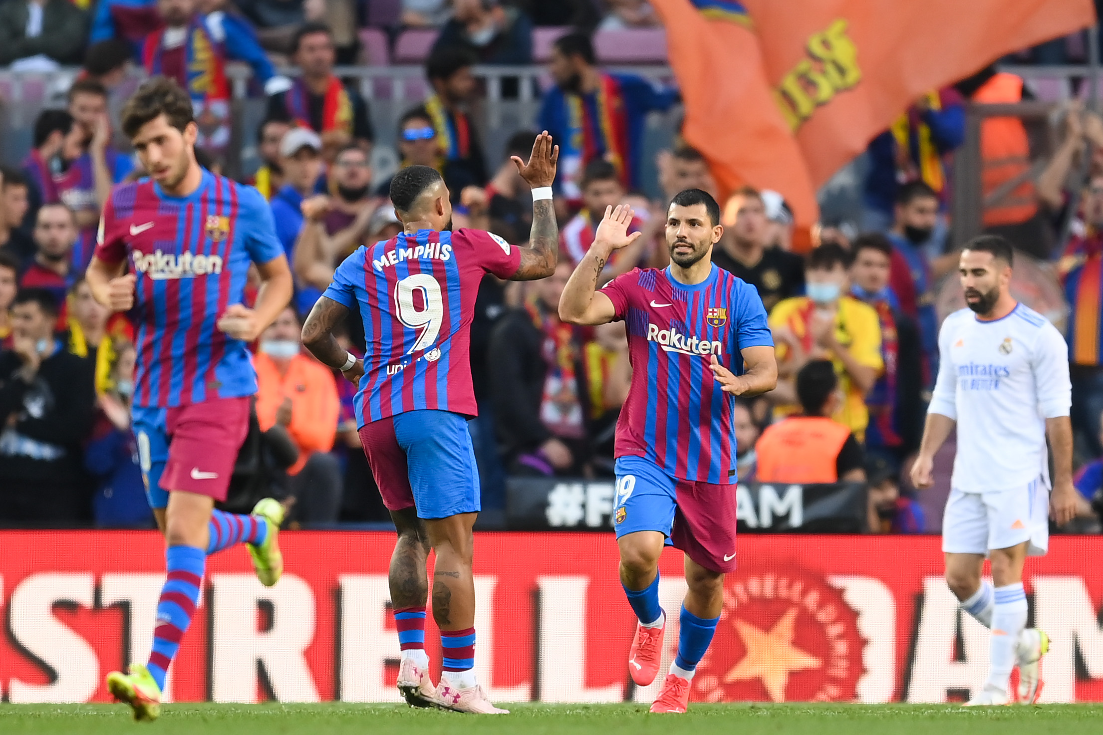 Sergio Aguero shares a celebratory moment with Memphis Depay following his solitary goal for Barcelona, netted against Real Madrid back in October 2021.