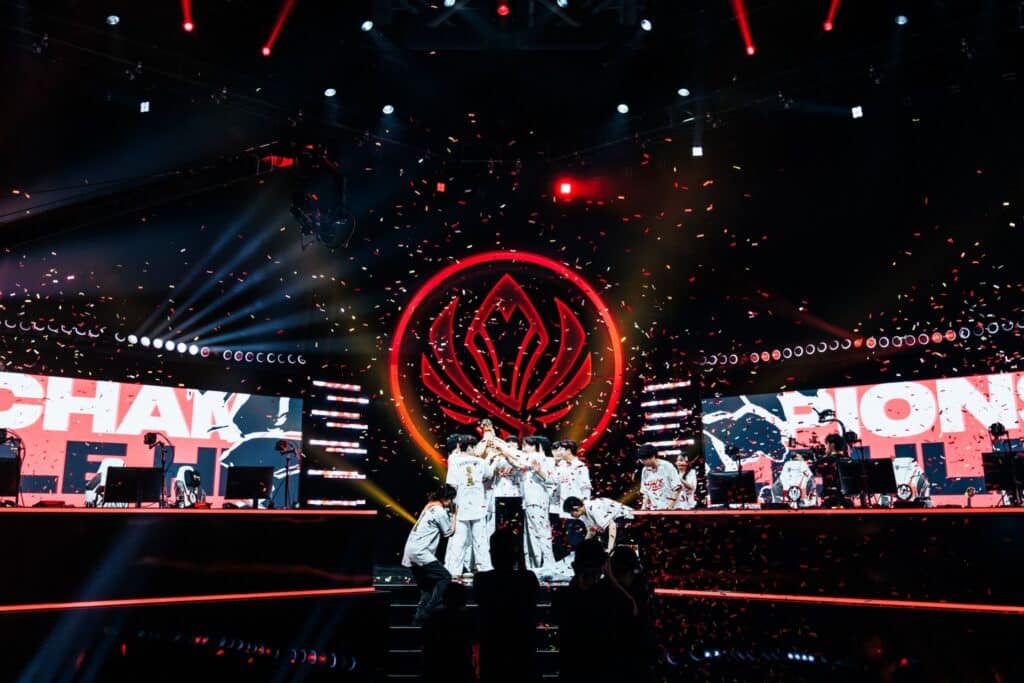 Photograph capturing Hanwha Life Esports players celebrating their championship victory at the 2026 League of Legends Mid-Season Invitational.