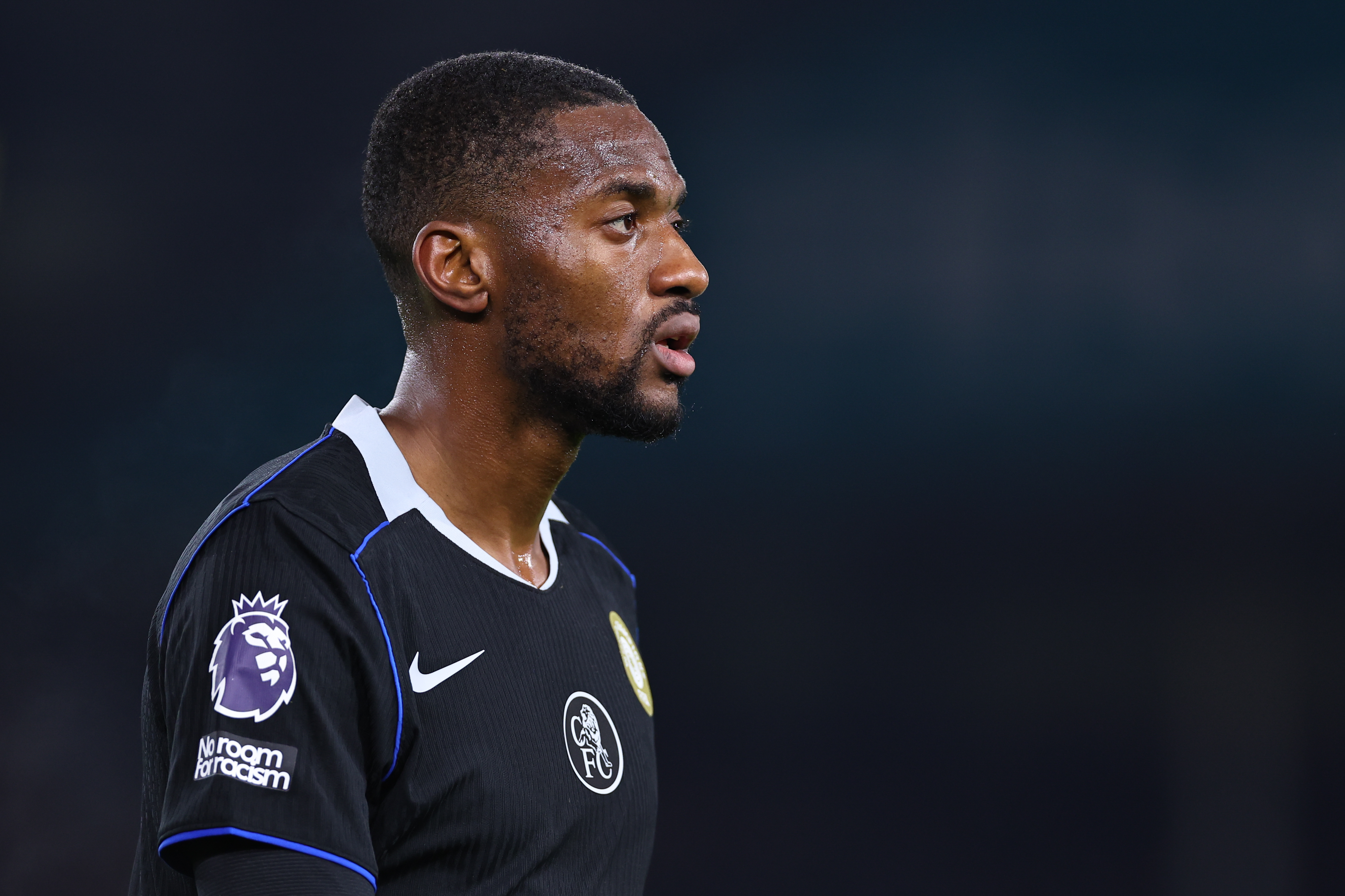 A side-profile, mid-shot of Chelsea's Tosin Adarabioyo walking.