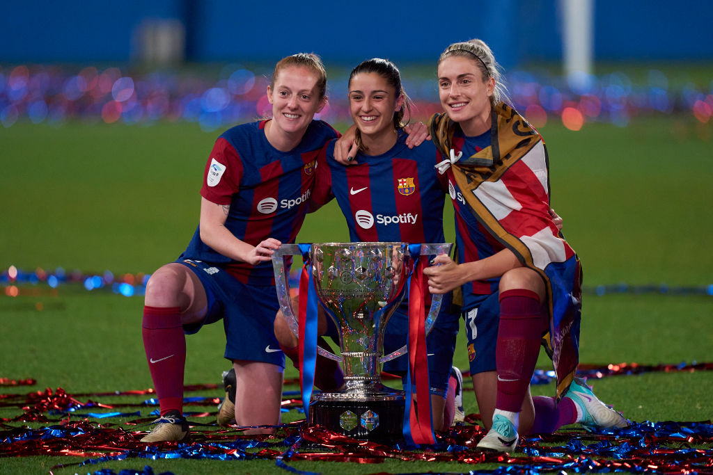 BARCELONA, SPAIN - MAY 10: Keira Walsh, Jana Fernandez and Alexia Putellas of FC Barcelona pose for a photo with the LigaF Trophy winner after the match between FC Barcelona and Athletic Club at Estadi Johan Cruyff on May 10, 2024 in Barcelona, Spain. (Photo by Pedro Salado/Getty Images)